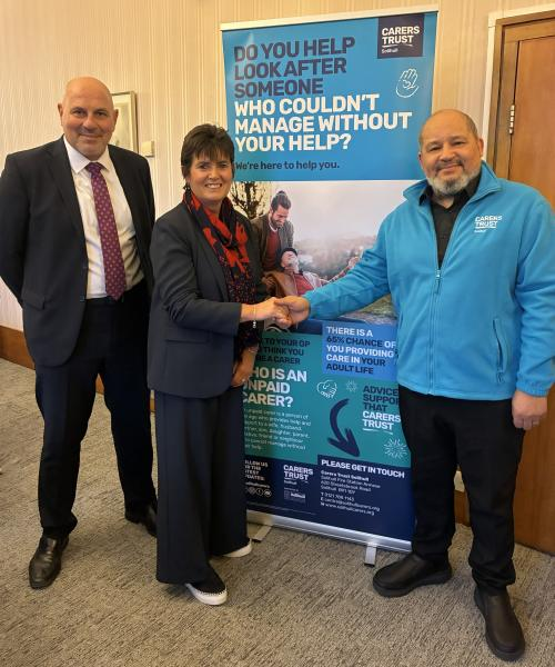 (left to right): Councillor Dicicco and Councillor Grinsell congratulate Brandon Scott-Omenka, on behalf of Carers Trust Solihull, on the new contract.